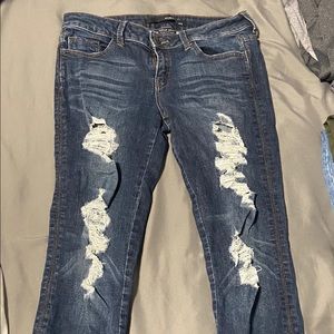 Dark wash distressed skinny jeans